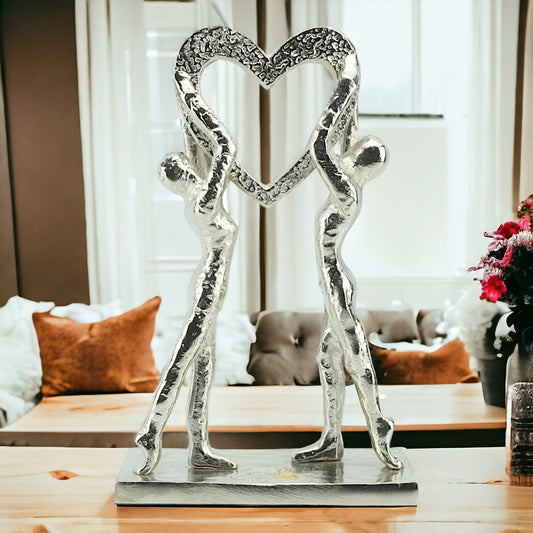 Silver Serenade: Handcrafted Aluminium Couple Holding Heart Sculpture