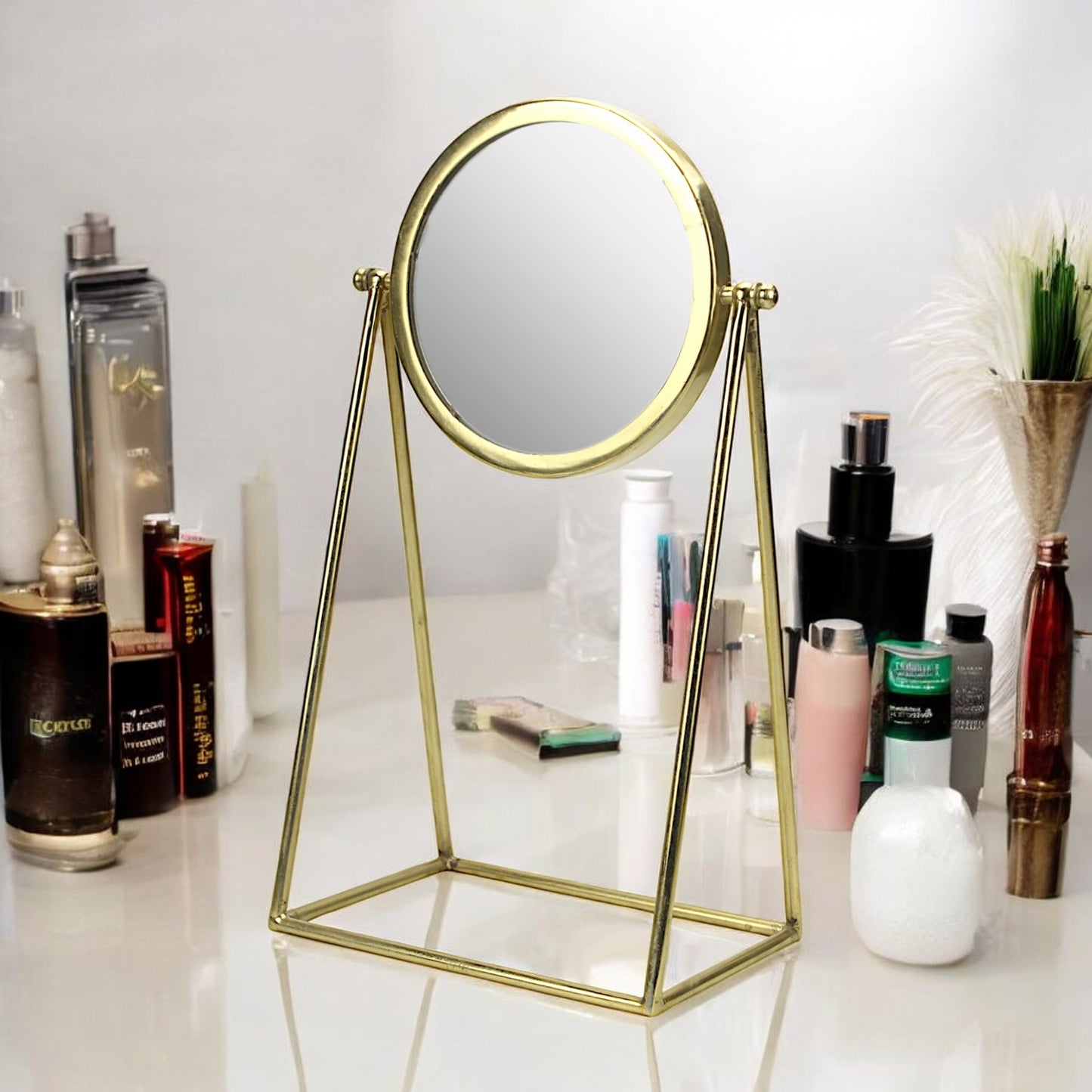 A Round Rotatable Vanity Mirror in Metal Frame with Metal Stand