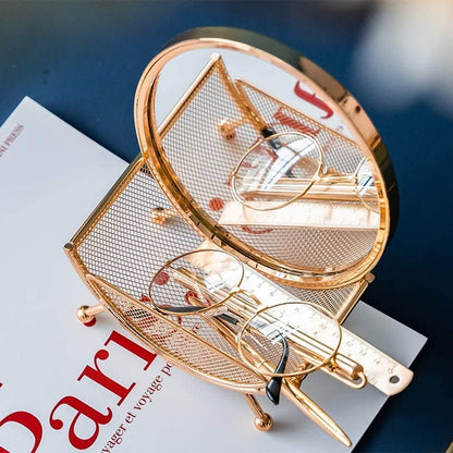A Round Vanity Mirror in Metal Frame Basket